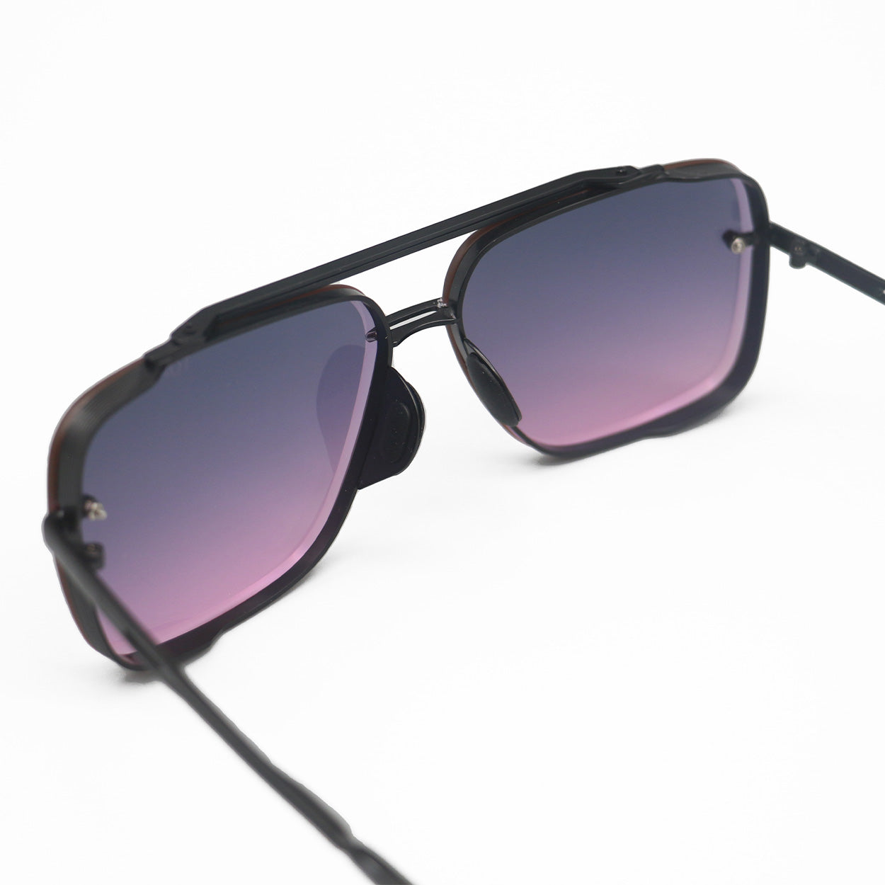  Bella Sunglasses are square aviators with faded purple to pink lenses and black metal details. Including tangle free technology.